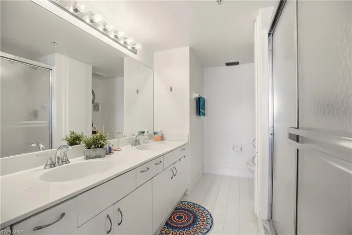 Primary bath with dual vanity and walk-in shower