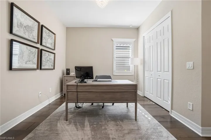 Office space with dark wood-style flooring