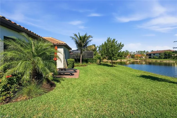 View of green lawn with a water view