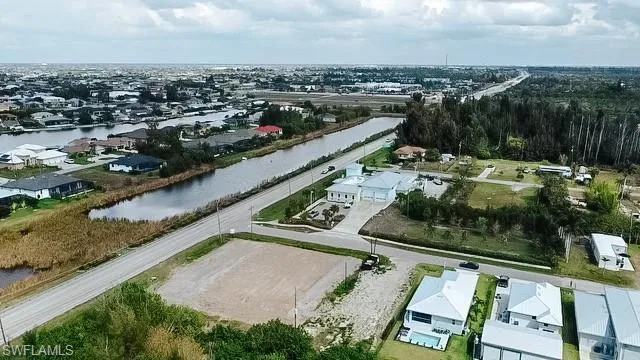 Aerial perspective of suburban area with a large body of water