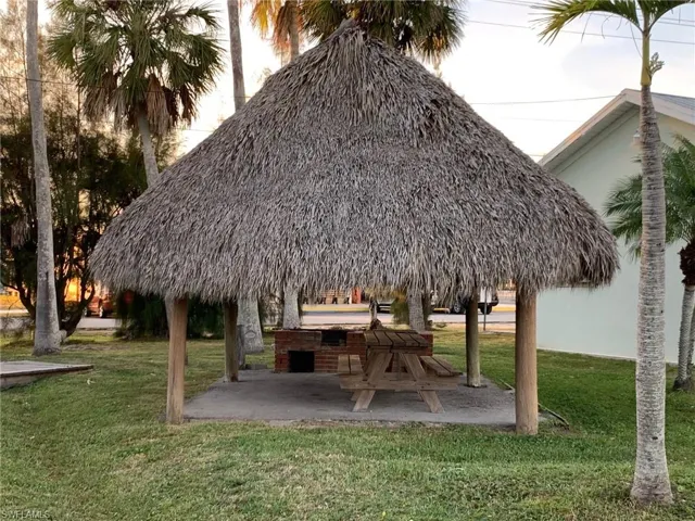 Community outdoor grill and picnic table