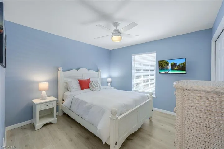 Bedroom featuring ceiling fan and light hardwood / wood-style floors