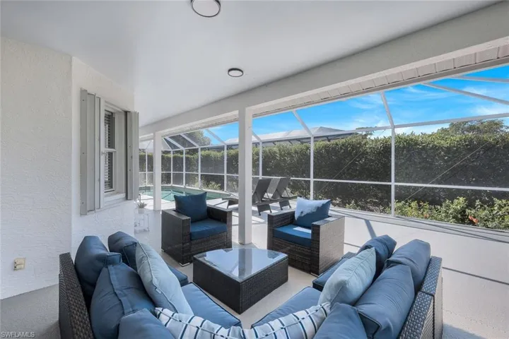 View of patio / terrace featuring outdoor lounge area and glass enclosure