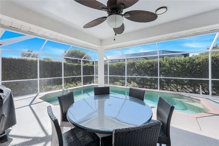 Sunroom / solarium with a pool