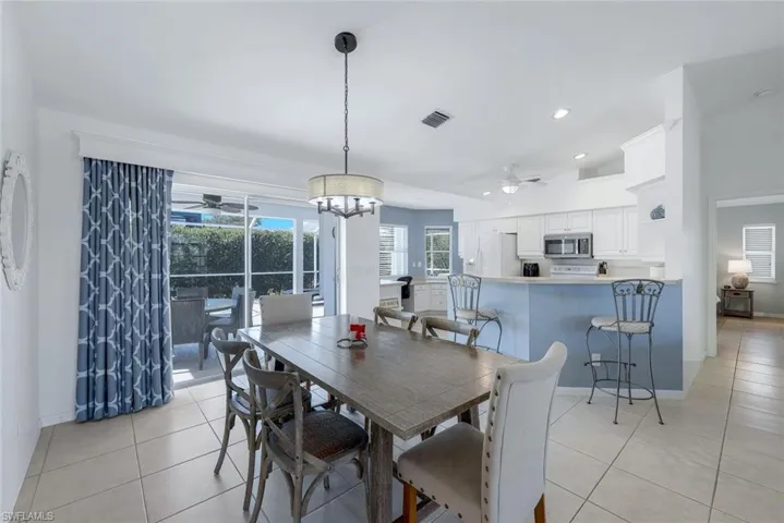 Tiled dining area with ceiling fan