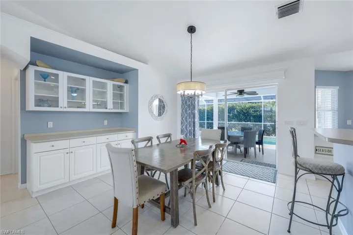 Tiled dining area with ceiling fan