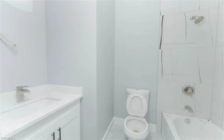 Full bath with vanity and bathtub / shower combination