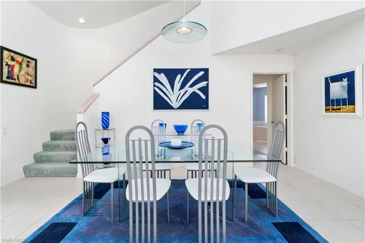 Tiled dining area with a high ceiling