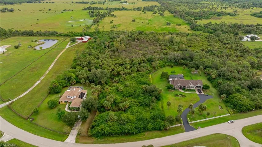 Aerial view of sparsely populated area featuring a large body of water
