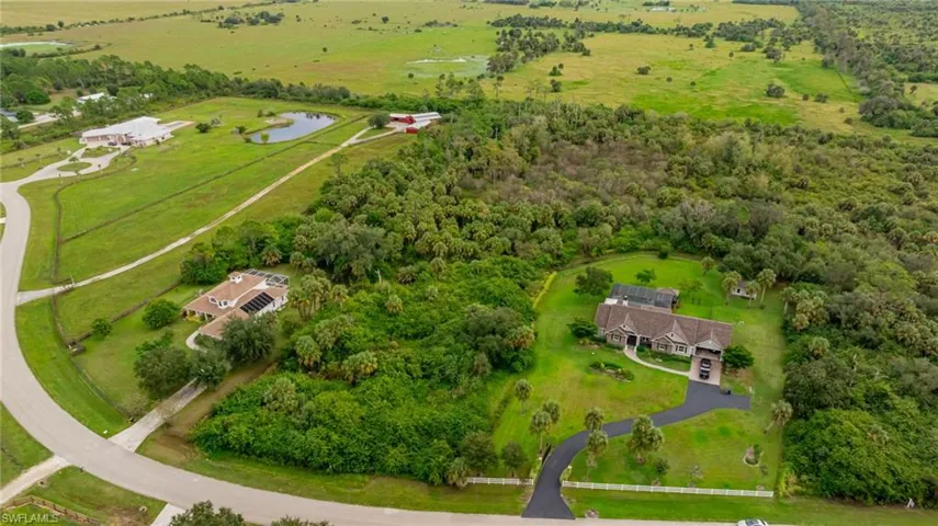 Aerial view of sparsely populated area featuring a nearby body of water