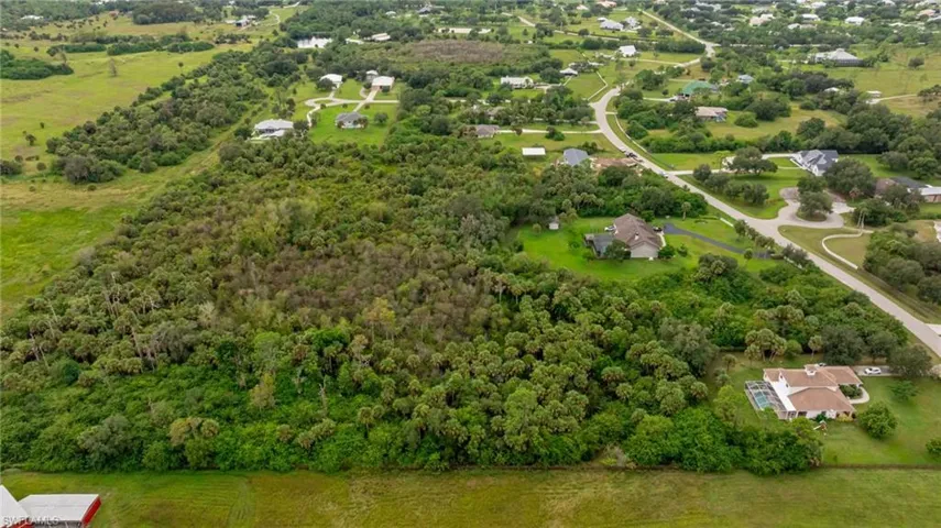 Aerial overview of property's location with a forest