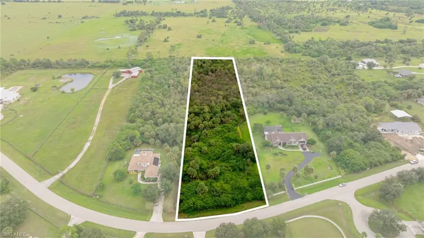 Aerial view of property's location featuring rural landscape and property boundaries highlighted