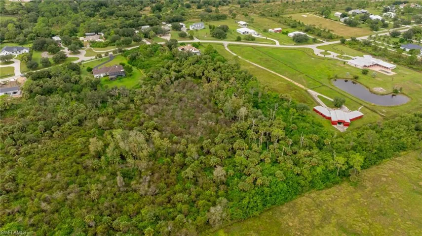 Aerial overview of property's location with a nearby body of water