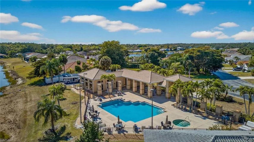 Community pool featuring a patio and a community hot tub