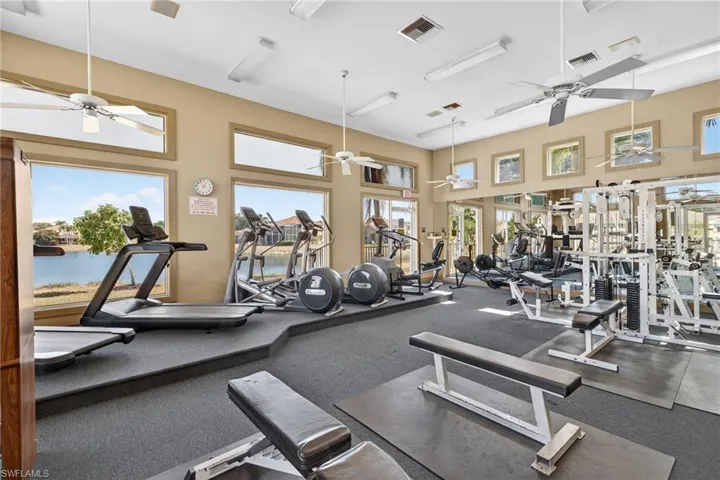 Exercise room featuring a high ceiling