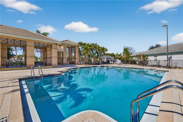 Community pool with a patio area