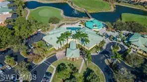 Bird's eye view with a water view and golf course view