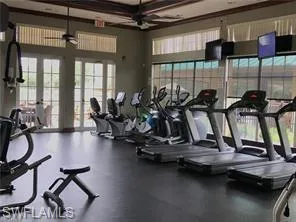 Exercise room with a ceiling fan