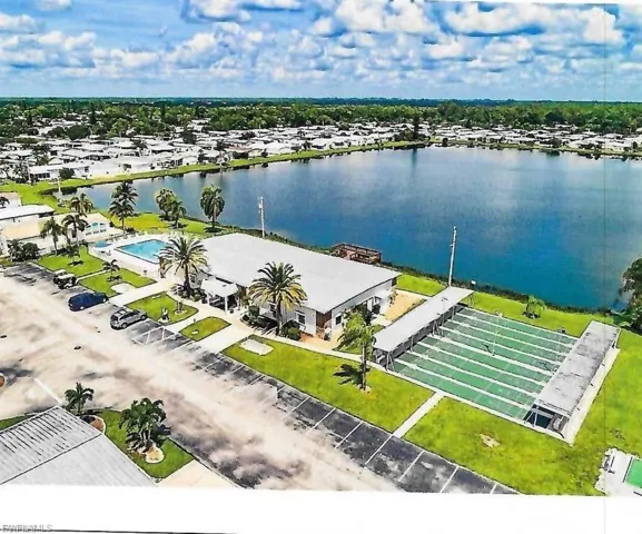 Aerial view of a nearby body of water and a pool
