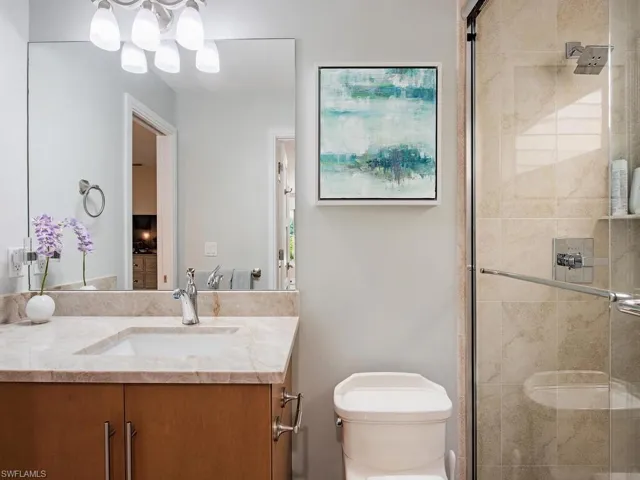 Full guest bath with vanity and a tile shower
