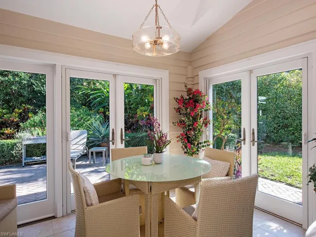 Sun room with french doors and vaulted ceiling