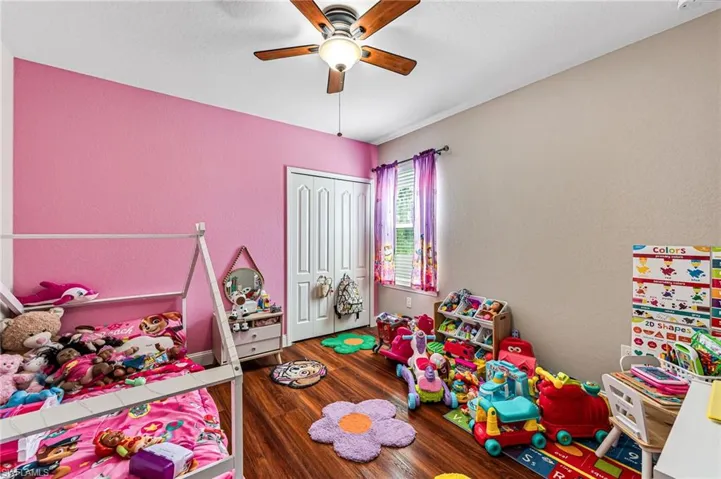 Game room with ceiling fan and hardwood / wood-style floors
