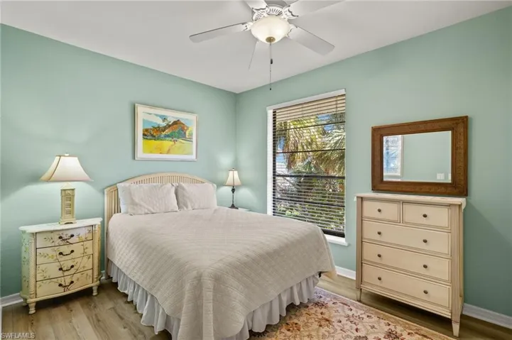 Bedroom featuring wood finished floors and ceiling fan