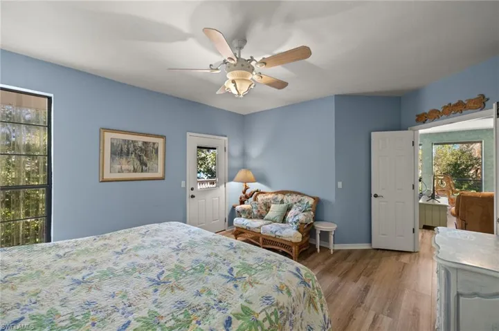 Bedroom featuring wood finished floors and ceiling fan