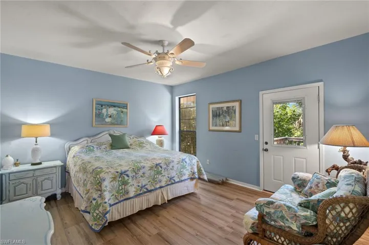 Bedroom featuring wood finished floors and ceiling fan