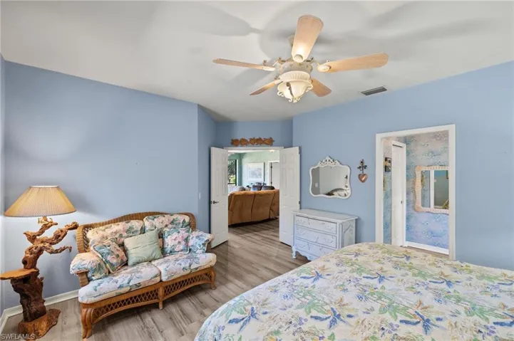 Bedroom with wood finished floors and a ceiling fan