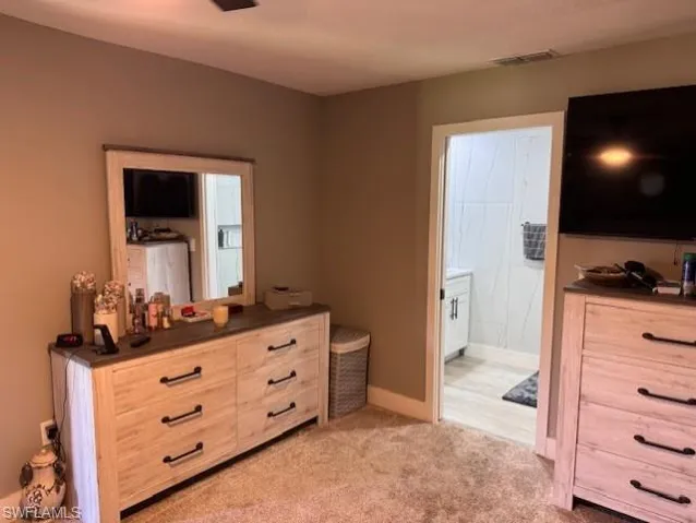 The large primary bedroom has an en-suite bathroom