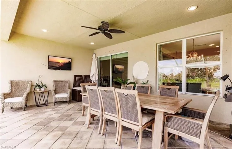View of patio featuring ceiling fan