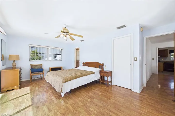 Bedroom with light wood-style flooring and ceiling fan