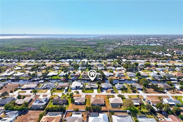 View of property location with nearby suburban area and a large body of water