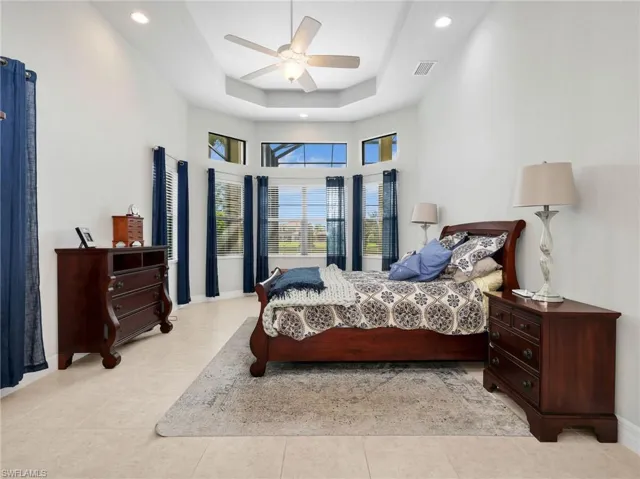 Master Bedroom featuring a bay window, recessed lighting, and a ceiling fan