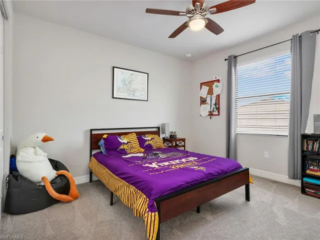 Neutral-toned walls and grey carpet flooring