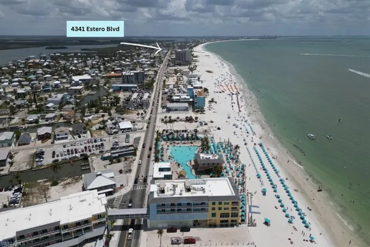 Aerial view of waterfront with a beach