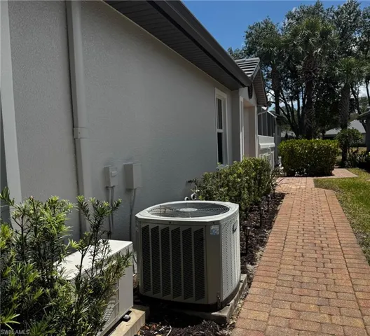 Stucco siding and a central AC unit