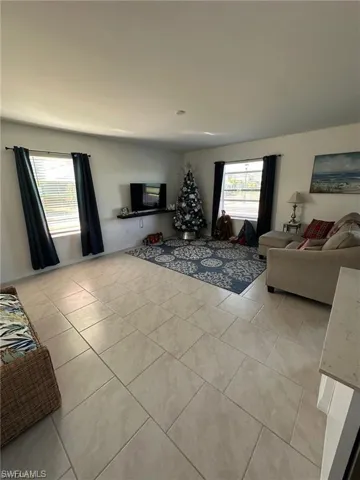 Living room featuring light tile patterned floors