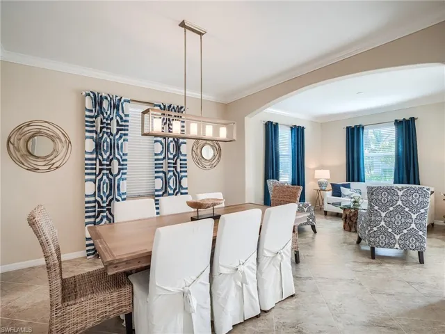 Tiled dining room with ornamental molding