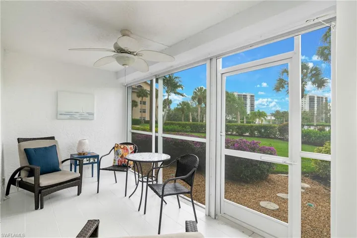 Lanai with new tile floor and new screen/framing - direct walk out access to the grounds and pool