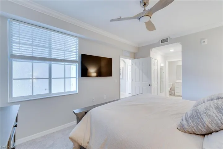 Large window and en-suite bath with two closets