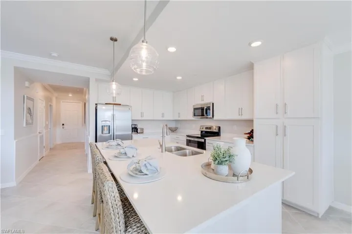 Island with seating, double sink and brushed nickel fixtures