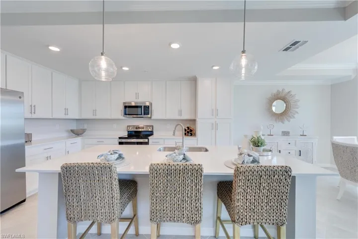 Cabinets to ceiling featuring pantry on the end