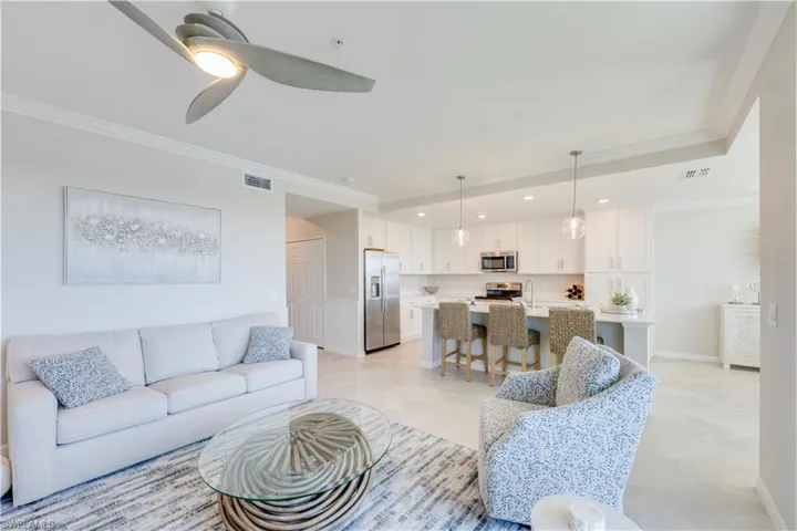 Ceiling fan, crown molding and porcelain tile