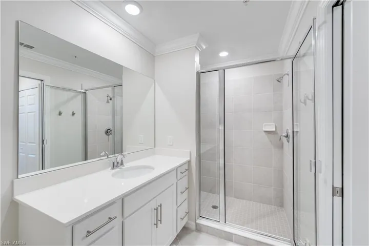 View of spacious tiled shower