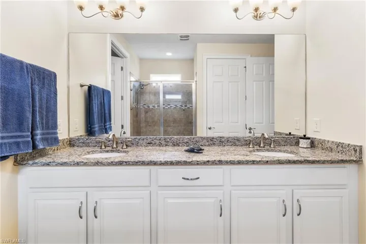 Bathroom featuring vanity and walk in shower