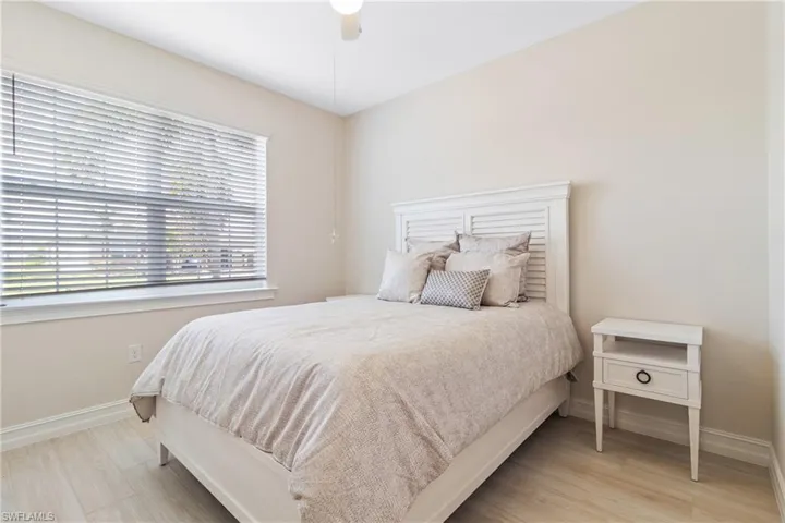 Bedroom featuring ceiling fan and hardwood / wood-style floors