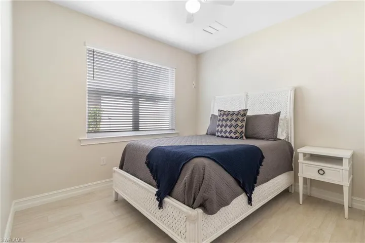 Bedroom featuring ceiling fan and light wood-type flooring