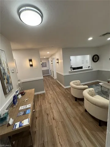 Waiting room with wood-type flooring